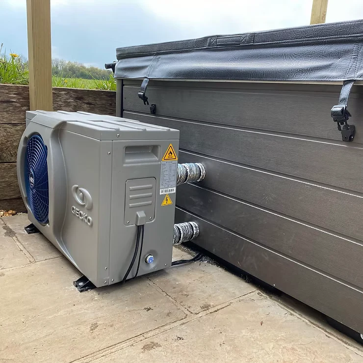 Gecko air-source heat pump connected to an outdoor hot tub.